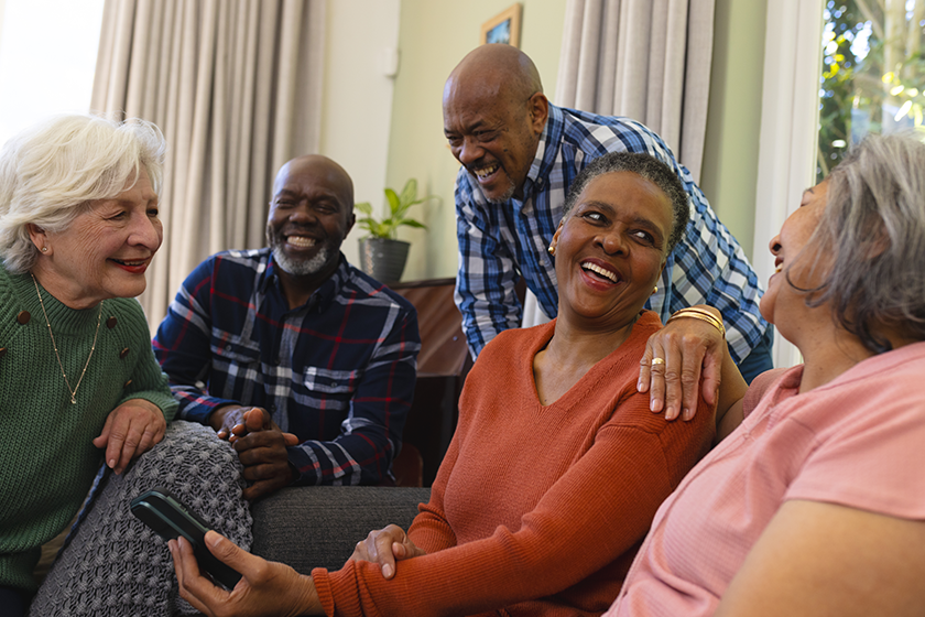 Happy diverse group of senior friends having video call